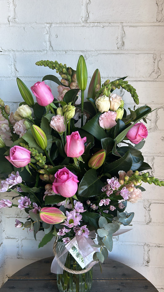 Roses, Lilly and seasonal flowers in a  vase